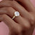 Round Cut Moissanite Twisted Shoulder Set Ring With Hidden Halo